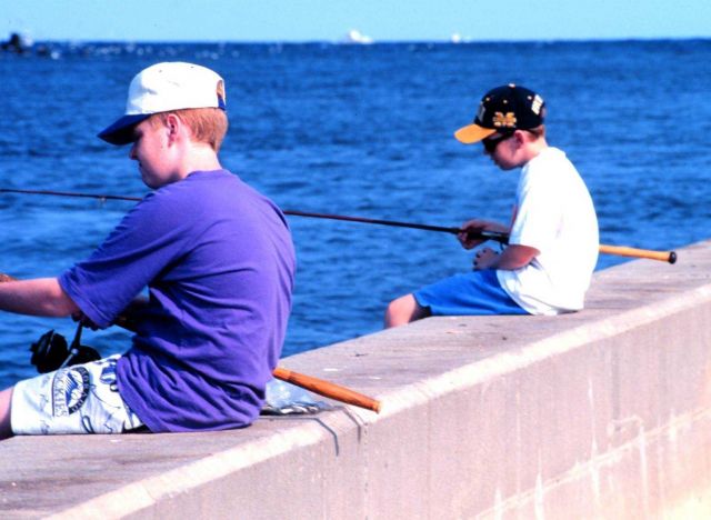 Buddies for life fishing along the seawall at Manasquan Inlet Picture
