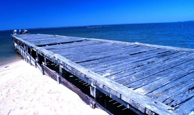 Fishing off a weather-beaten pier at Westland Beach Picture