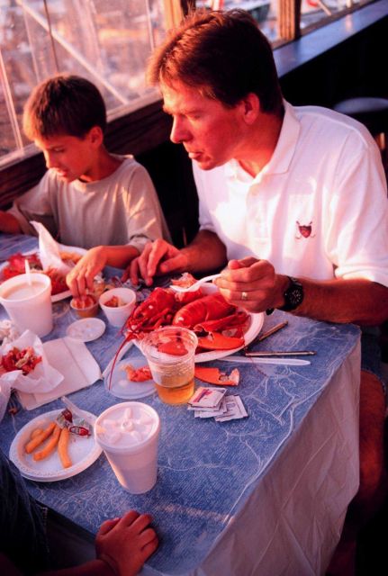 Father and son enjoying the fruits of the sea Picture