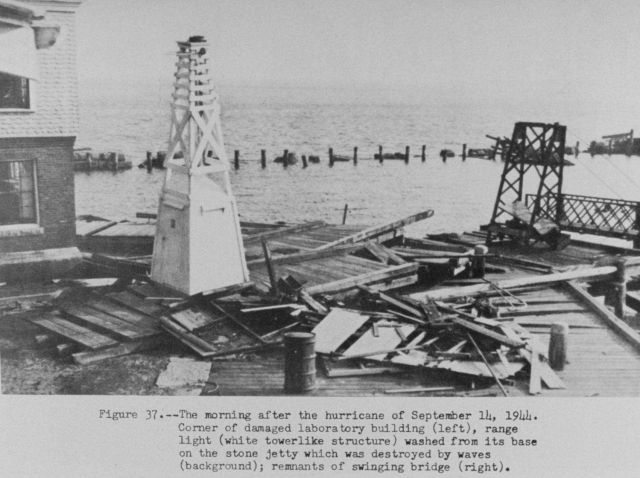 The morning after the hurricane of September 14, 1944 showing damage to piers and navigation aid. Picture