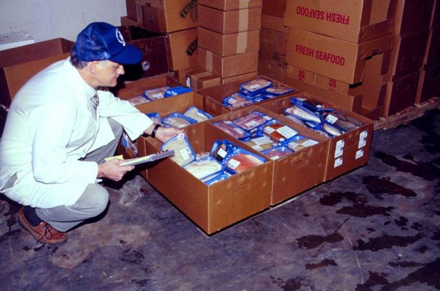 Labeled packages are boxed and inspected at a Baltimore plant before shipment to local markets. Picture