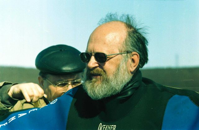 Biologists of MMBI help to dress diver before diving Picture