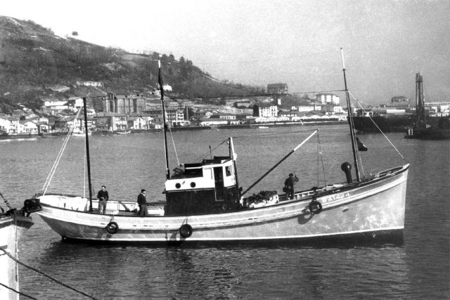 Pole and line fishing vessel with live bait container on the foredeck. Picture