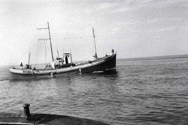 Boat rigged for pole and line fishing Picture
