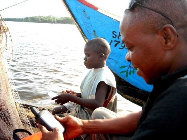 Boy mending net Picture