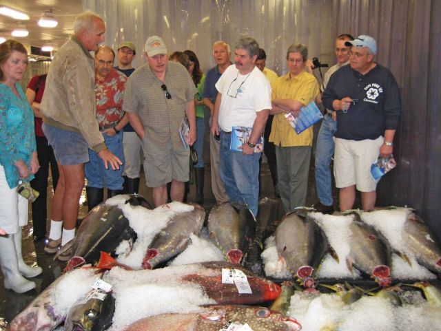 Jim Cook, a longline fishing boat owner and vice president of Pacific Ocean Producers, leads an early morning tour for MAFAC members and NOAA Fisherie Picture