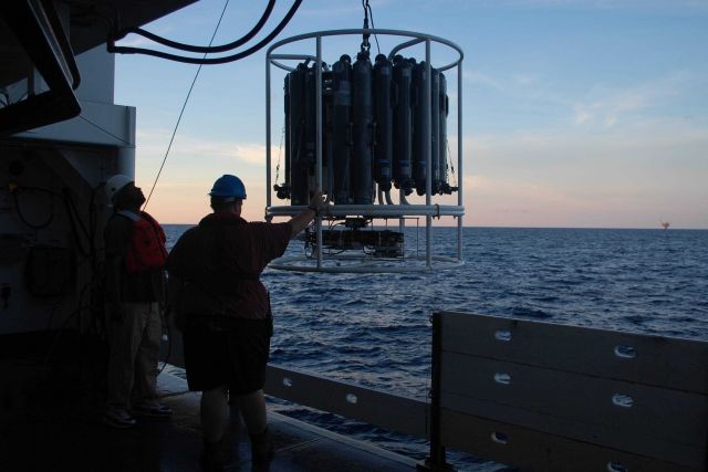 CTD rosette being deployed at sunset Picture