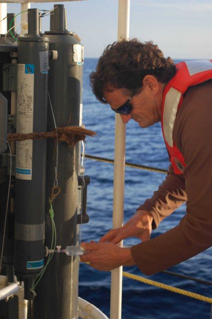 Taking water sample for further analysis from CTD rosette on board NOAA ship PISCES. Picture