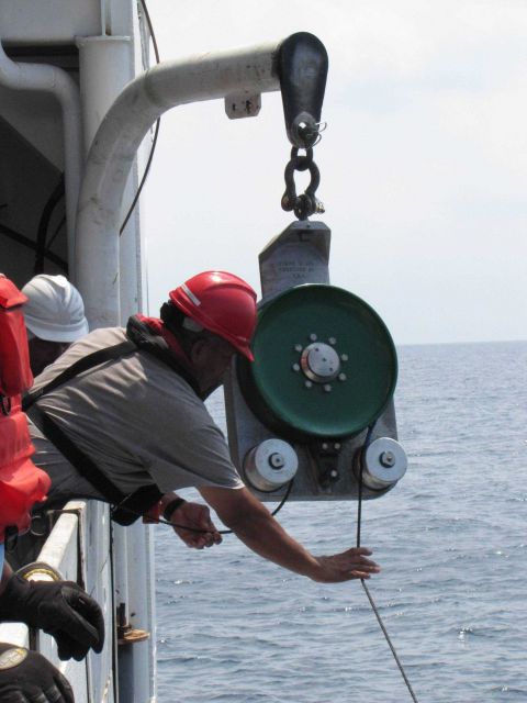 Recovering fish trap with power block. Picture