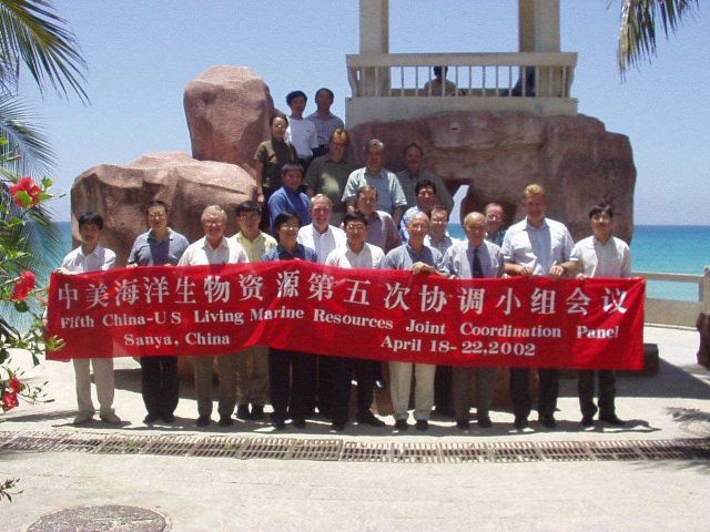 Chinese and American panel members on the beach in Hainan, China. Picture