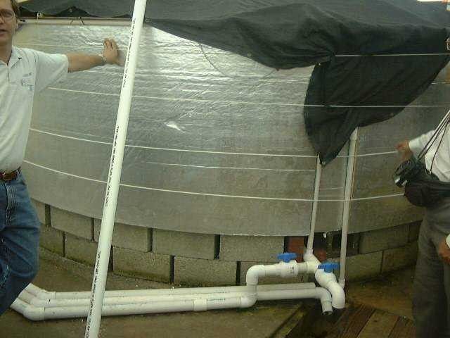 Circular tank with cover and insulation to maintain temperature control for culture of fish at Harbor Branch Oceanographic Institute Picture
