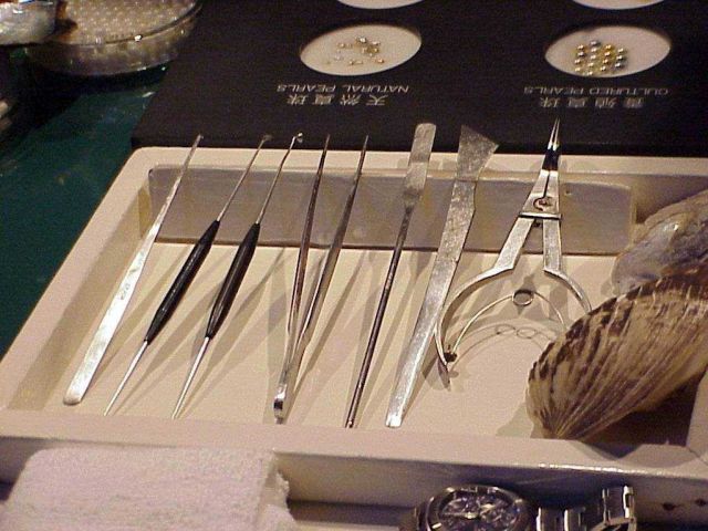 Hand tools used for removing, grading and sizing cultured pearls. Picture