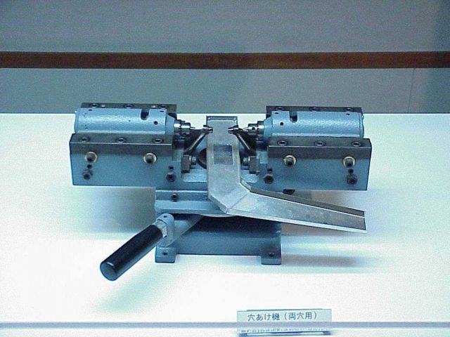 Machine used for holding a cultured pearl in preparation for jewelry making. Picture