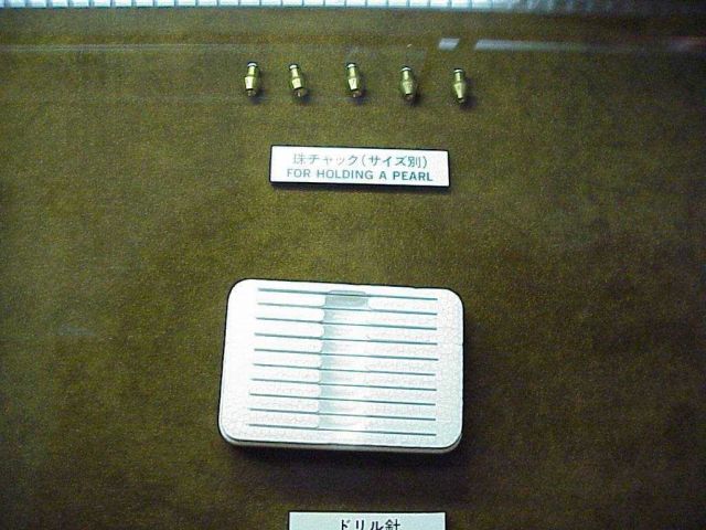 Metal tips used in holding a cultured pearl when making jewelry. Picture