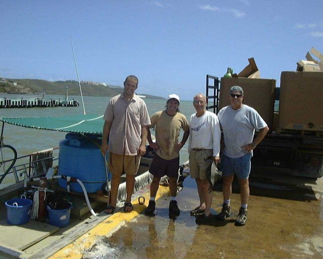 Staff preparing boat to tranport juvenile cobia to offshore cage in Puerto Rico at Culebra Island Picture
