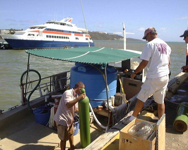 Compressed air tanks being loaded to supplement oxygen for transportation tank for cobia (Rachycentron candum) used in offshore cage culture Picture