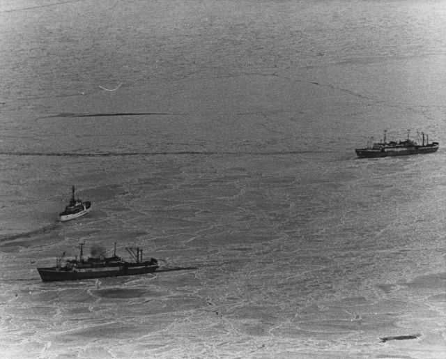 CGC STORIS underway in ice to BMRT KOLYVAN which is stuck in the ice. Picture
