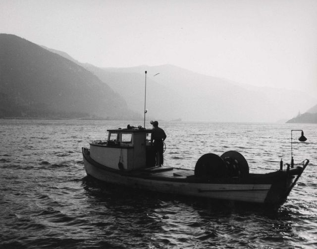 Salmon gill net boat going to set nets at sundown. Picture