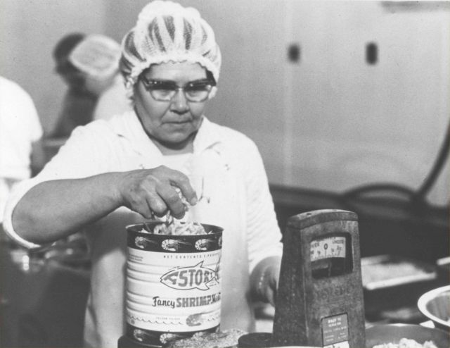 Woman working in a shrimp processing plant in Oregon. Picture