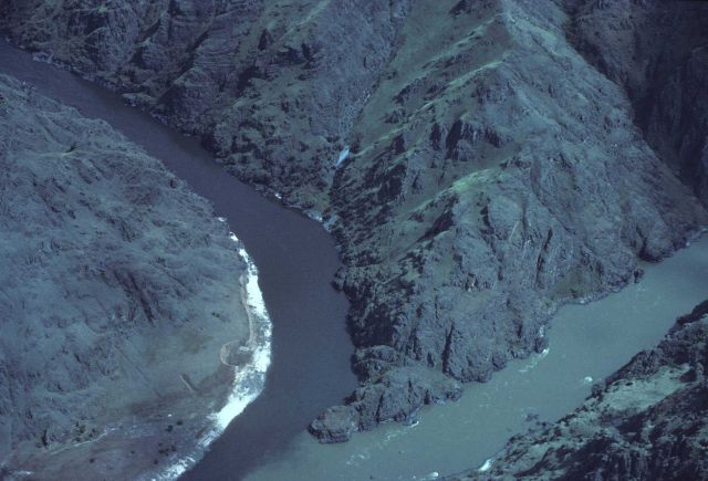 Confluence of rivers - one is sediment laden, the other clear. Picture