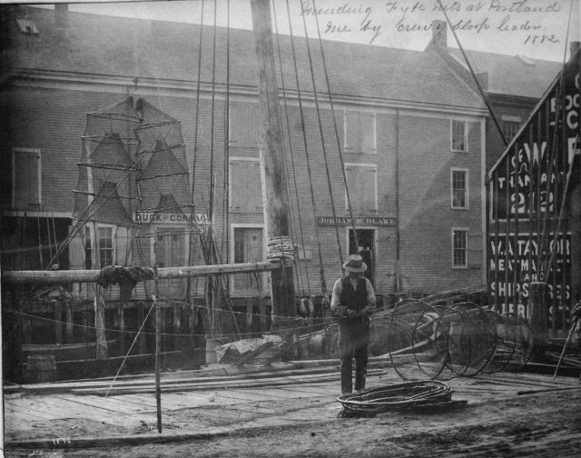 Mending fyke nets at Portland, ME, by crew of sloop Leader, 1882. Picture