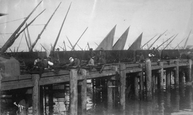 Pier and lateen-rigged boats. Picture