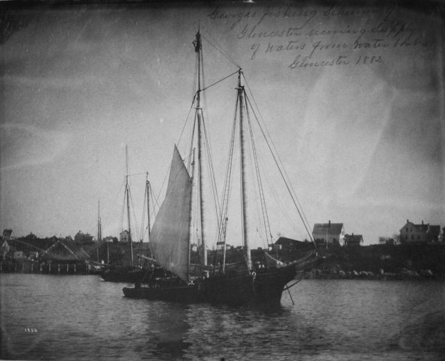 Georges Bank fishing schooner receiving supply of water from water boat. Picture