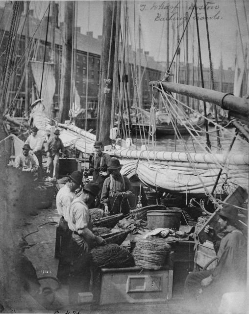 T Wharf, Boston, baiting trawls. Picture