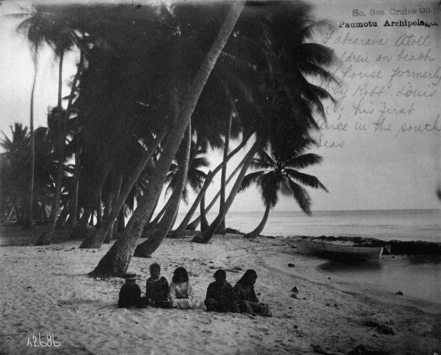 Fakarava Atoll, children on beach with site of house formerly occupied by Robt Picture