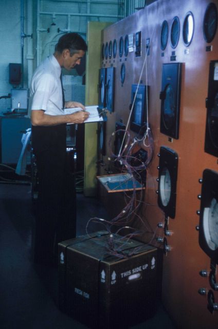 An engineer at the Gloucester Technological Laboratory tests newly developed plastic container for shipping iced fresh fish long distances Picture