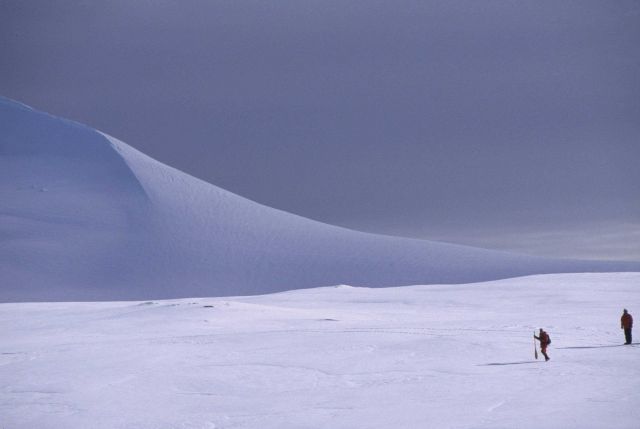 Scientists on a trek across the ice and snow give scale to an Antarctic landscape. Picture