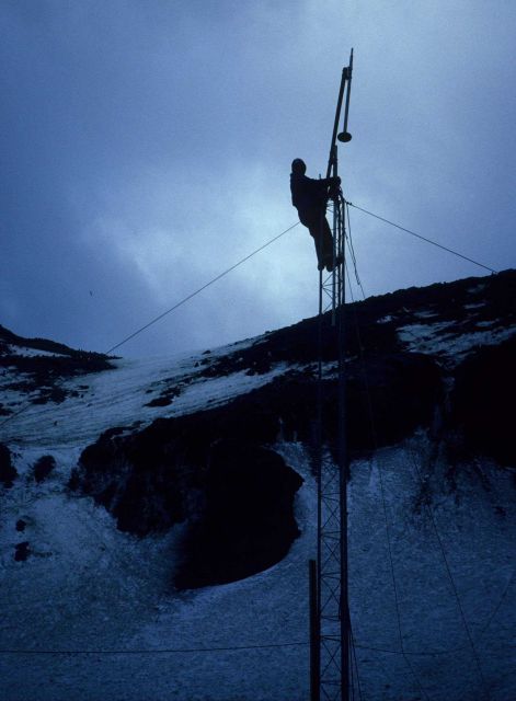 An AMLR scientist sets up the Seal Island field station's radio antenna. Picture