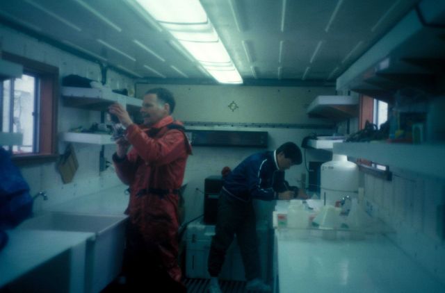 AMLR Scientists prepare the brand new zooplankton sorting lab, built into a cargo container. Picture