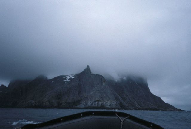 A misty Antarctic mountaintop, as seen from a Zodiac, South Shetland Islands. Picture