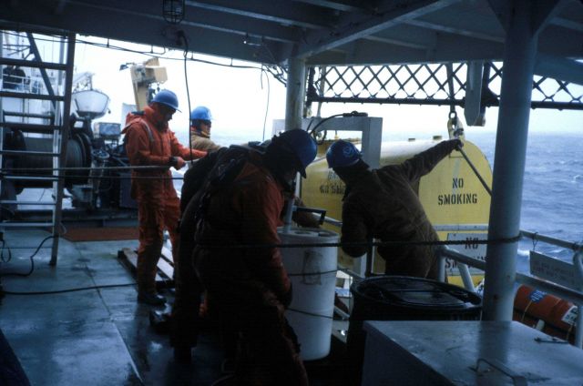 Preparing to deploy a piece of oceanographic equipment aboard the NOAA Ship Surveyor. Picture