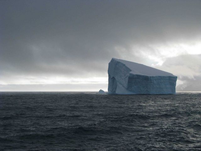 An iceberg in rough seas. Picture