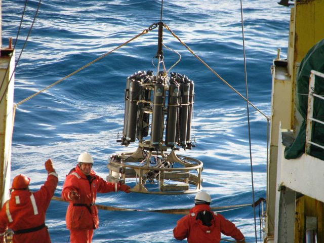 The crew of the R/V Yuzhmorgeologiya deploys a CTD from the stern. Picture