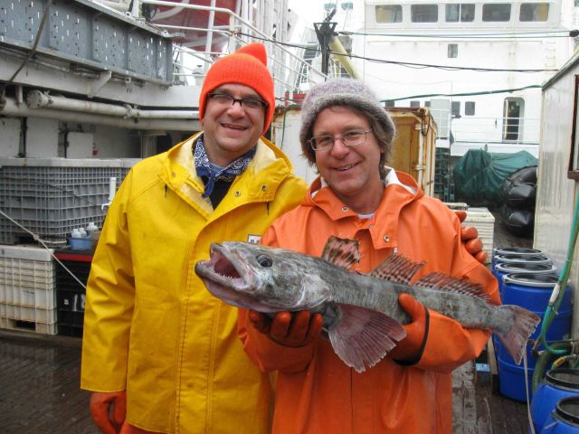 Proud Antarctic ichthyologists with their catch, a toothfish. Picture