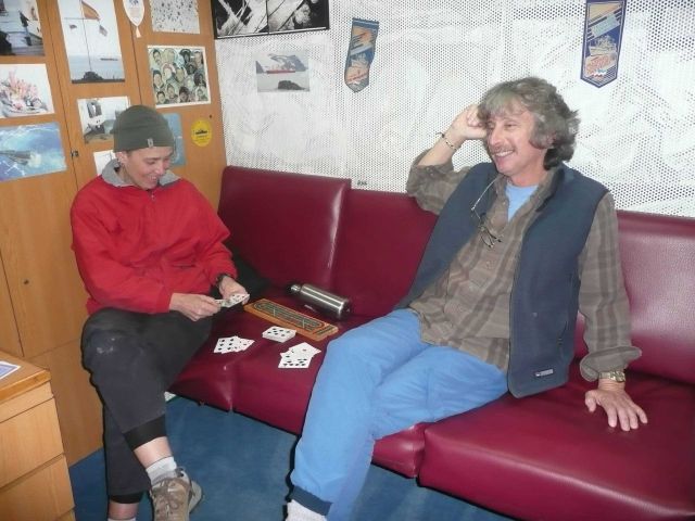 Zooplankton expert Kimberly Dietrich and veteran seabird observer Mike Force relax on the R/V Yuzhmorgeologiya by playing cribbage. Picture