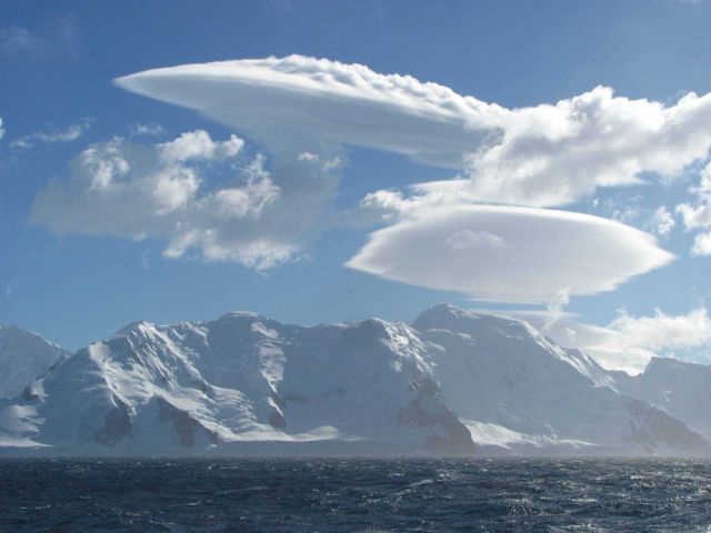 Saucer-shaped lenticular clouds, South Shetland Islands. Picture