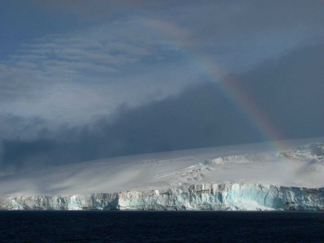 A rainbow over a glacier, South Shetland Islands, Antarctica. Picture