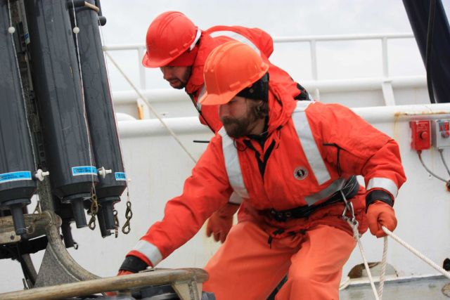 AMLR crew maneuvers water-collection equipment. Picture