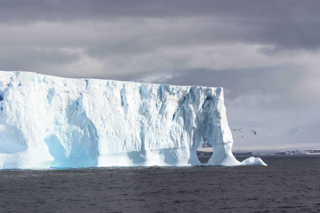The edge of a tabular iceberg, sculpted by the ocean. Picture