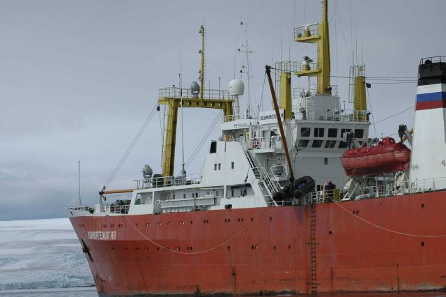 A Zodiac inflatable boat is lowered over the side of the R/V Yuzhmorgeologiya to carry scientists and supplies to the Copacabana field station. Picture