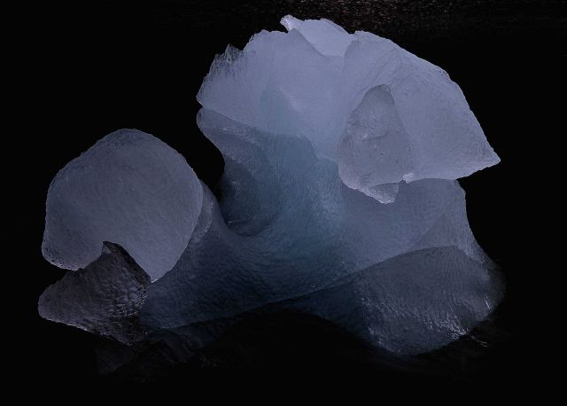 Ice that has been shaped by lapping waves . Picture