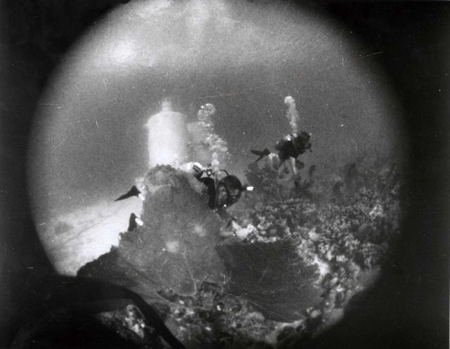 Underwater geologic studies being performed by Tektite scientist-aquanaut in the barrier reef surrounding the Tektite Habitat. Picture