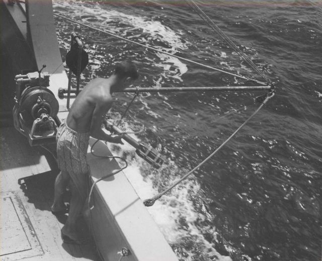 A bathythermograph being deployed by lanyard from the Fisheries Research Vessel HUGH M Picture