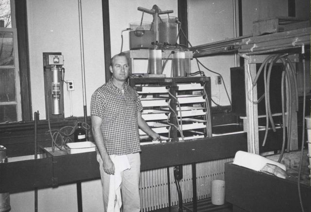 Apparatus to study the effects of the addition of food to sea water on the growth of recently-set oysters. Picture