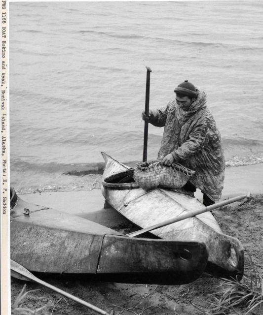 Native American Eskimo and kayak Picture