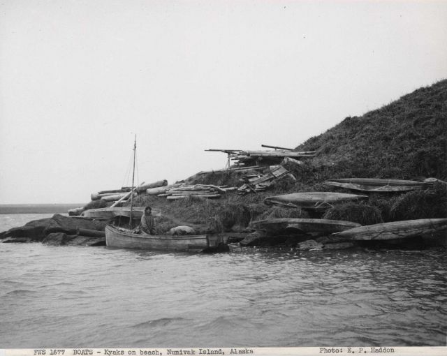 Kayaks and a small sailing craft on the 